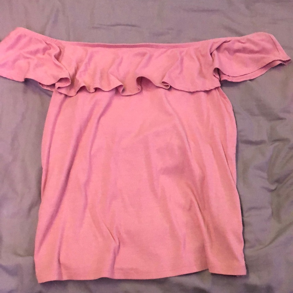 Light rose pink, off the shoulder top and ruffles around the top.